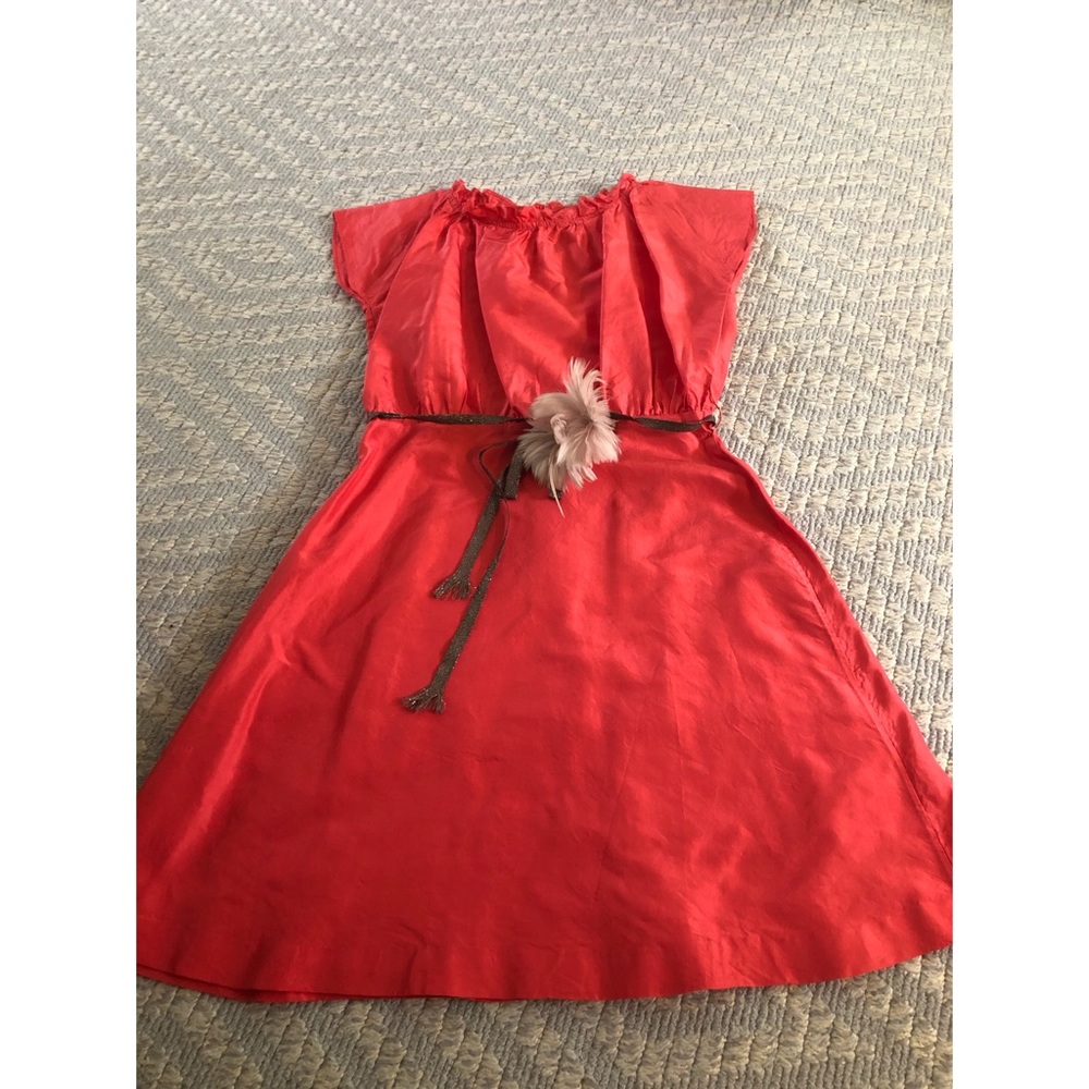 Red formal dress with tie and flower detail